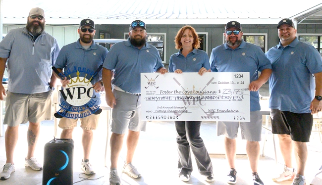 WPC donation check for Foster the Love Louisiana.