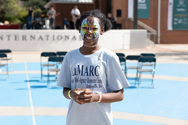 girl with painted face smiling