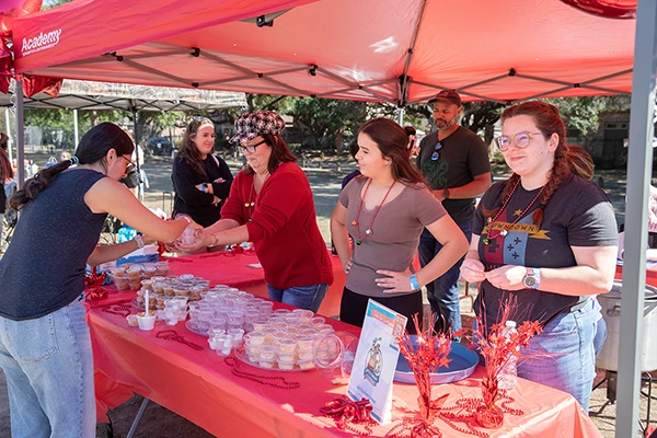 chili team serving chili under red tent