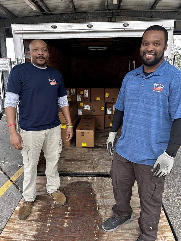 Home Furniture employees unloading mattresses