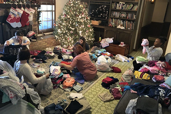 Sorting donations at the home of our founder.